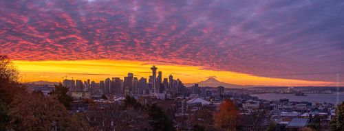Seattle Kerry Park Photography Sunrise Colors Curve Panorama A breathtaking panorama of Seattle bathed in fall light as a vast carpet of sunrise clouds stretches across the sky. Note the Mount Rainier sunrise shadow. The...