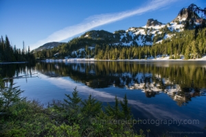 Tatoosh Range Reflection Clouds Dusk light illuminates the Tatoosh Range behind Reflection Lake in Mount Rainier National Park.