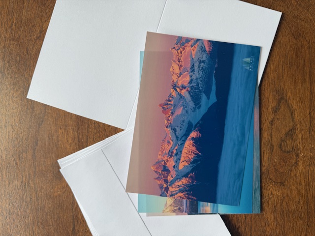 A small photographic print and field note prepared for mailing