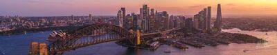Aerial Panorama of Sydney Harbour Bridge, Opera House and Crown Sydney at Sunset A sweeping panoramic aerial view of Sydney Harbour at sunset, featuring the majestic Harbour Bridge, the world-famous Opera House, and the gleaming towers of...