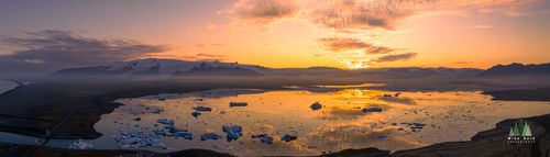 Jökulsárlón Ice Lagoon Sunset – Aerial Panorama of Iceland’s Glacial Beauty This breathtaking aerial panorama captures the glowing sunset over Iceland’s Jökulsárlón Ice Lagoon, where drifting icebergs reflect the warm golden light of...