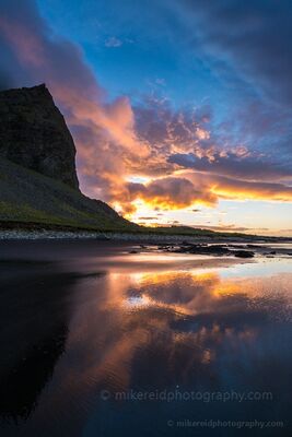 Stokksnes Sunrise Reflections – Iceland Black Sand Beach | Fine Art Landscape Photography Vibrant sunrise light ignites the sky over Stokksnes Beach in southeastern Iceland, reflecting in the wet black sands below. This fine art photograph by Mike...