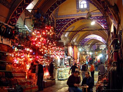 Grand Bazaar Lanterns and Morning Life in Istanbul Colorful glass lanterns illuminate the historic Grand Bazaar in Istanbul, Turkey, as merchants prepare their shops and visitors wander through its vaulted...