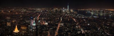 Lower Manhattan Skyline and City Lights at Night Panorama A sweeping nighttime panorama of Manhattan, New York City, looking south toward the illuminated Financial District and One World Trade Center. Thousands of city...