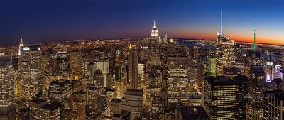 Manhattan Skyline at Blue Hour from Top of the Rock A sweeping panoramic view of Midtown Manhattan at blue hour, photographed from the Top of the Rock observation deck at Rockefeller Center in New York City. The...