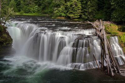 Lower Lewis Falls, Washington Lower Lewis Falls spreads across a broad rock ledge on the Lewis River in southern Washington, creating a wide curtain of cascading water beneath the...