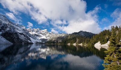 Skies and Mountains Reflected in Snow LAke