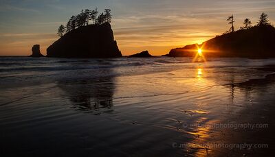 Second Beach Sunset Sunstar Through the Hole in the Wall The setting sun aligns with the Hole in the Wall at Second Beach on Washington’s Olympic Coast, creating a bright sunstar between the dark coastal rocks. Golden...
