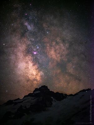 Milky Way Over Little Tahoma Peak at Mount Rainier The brilliant core of the Milky Way rises above the rugged silhouette of Little Tahoma Peak in Mount Rainier National Park, Washington. Countless stars fill the...