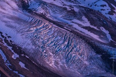 Winthrop Glacier Ice Patterns on Mount Rainier Intricate patterns of fractured ice, deep crevasses, and sweeping glacial ridges reveal the remarkable textures of Winthrop Glacier on Mount Rainier in...