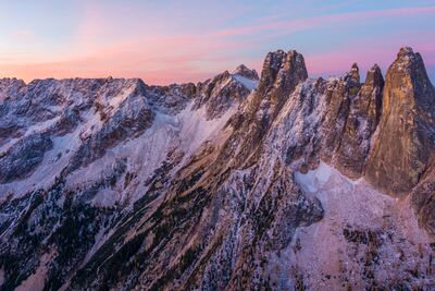Over the Northwest Liberty Bell and Early Winters Spires Sunrise Soft sunrise light paints Liberty Bell and the Early Winters Spires in warm alpine hues above Washington Pass in the North Cascades. Captured from the air by...
