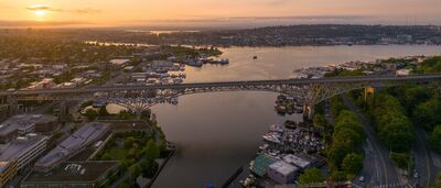 Aurora Bridge Over the Lake Washington Ship Canal at Sunset, Seattle An aerial panorama of Seattle's Aurora Bridge spanning the Lake Washington Ship Canal between Queen Anne and Fremont, with Wallingford and the surrounding...