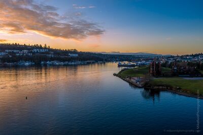 Sunset Over Lake Union and Gas Works Park An aerial evening view across Seattle’s Lake Union with Gas Works Park on the right, Queen Anne Hill along the left shoreline, and the Aurora Bridge spanning...