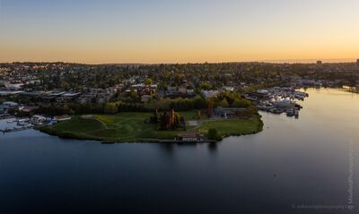 Gas Works Park and Lake Union at Sunrise A calm aerial sunrise view over Seattle’s Lake Union with Gas Works Park extending into the water below. Soft golden morning light reflects across the lake...