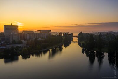 University of Washington and Montlake Cut at Sunrise Aerial view over Seattle’s University of Washington district at sunrise, with UW Medical Center and Husky Stadium on the left and the Montlake Cut running...