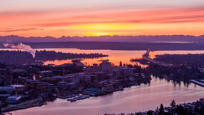 Seattle Sunrise Over Portage Bay and the SR 520 Floating Bridge A sunrise aerial over Seattle’s Portage Bay, looking east toward the SR 520 floating bridge with Laurelhurst in the middle distance and the University of...