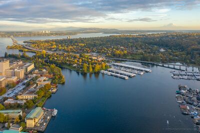 Portage Bay, SR 520 Bridge, and Bellevue from Above An aerial view over Seattle’s Portage Bay with the SR 520 Bridge crossing the middle of the scene, the Seattle Yacht Club along the waterfront, UW Medical...